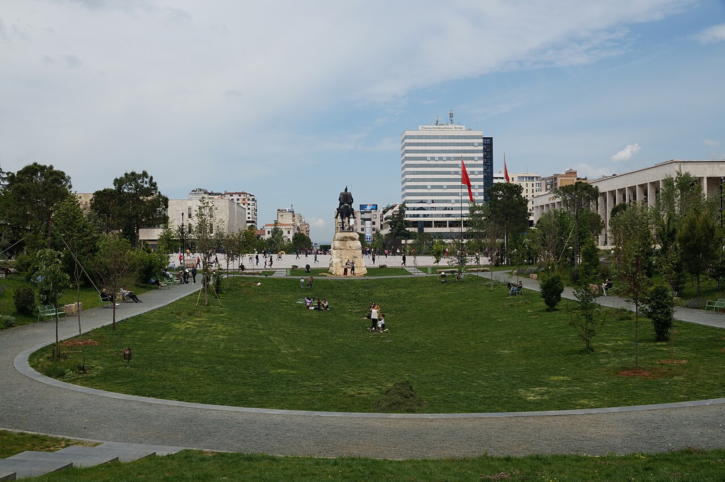 Skanderbeg equestrian statue beyond lawns and paths in central Tirana